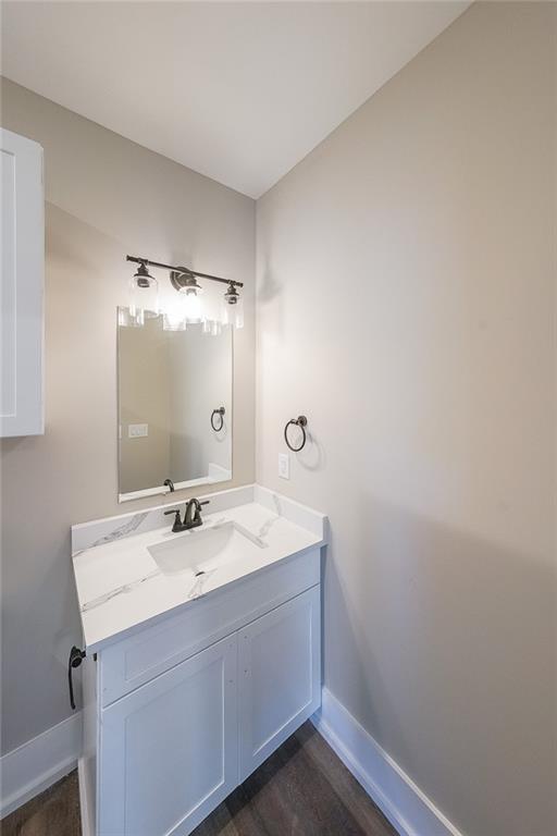 1360 Dickens Road Northwest Lilburn, GA 30047 - Photo 21 of 45 a bathroom with a sink mirror and vanity