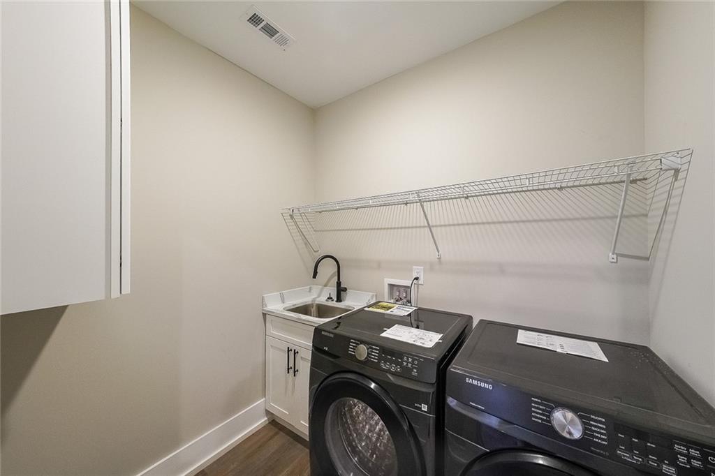 1360 Dickens Road Northwest Lilburn, GA 30047 - Photo 23 of 45 a utility room with dryer and washer