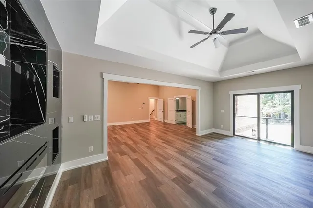 wooden floor in an empty room with a window