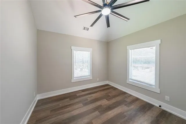 a bathroom with a sink toilet vanity and bathtub