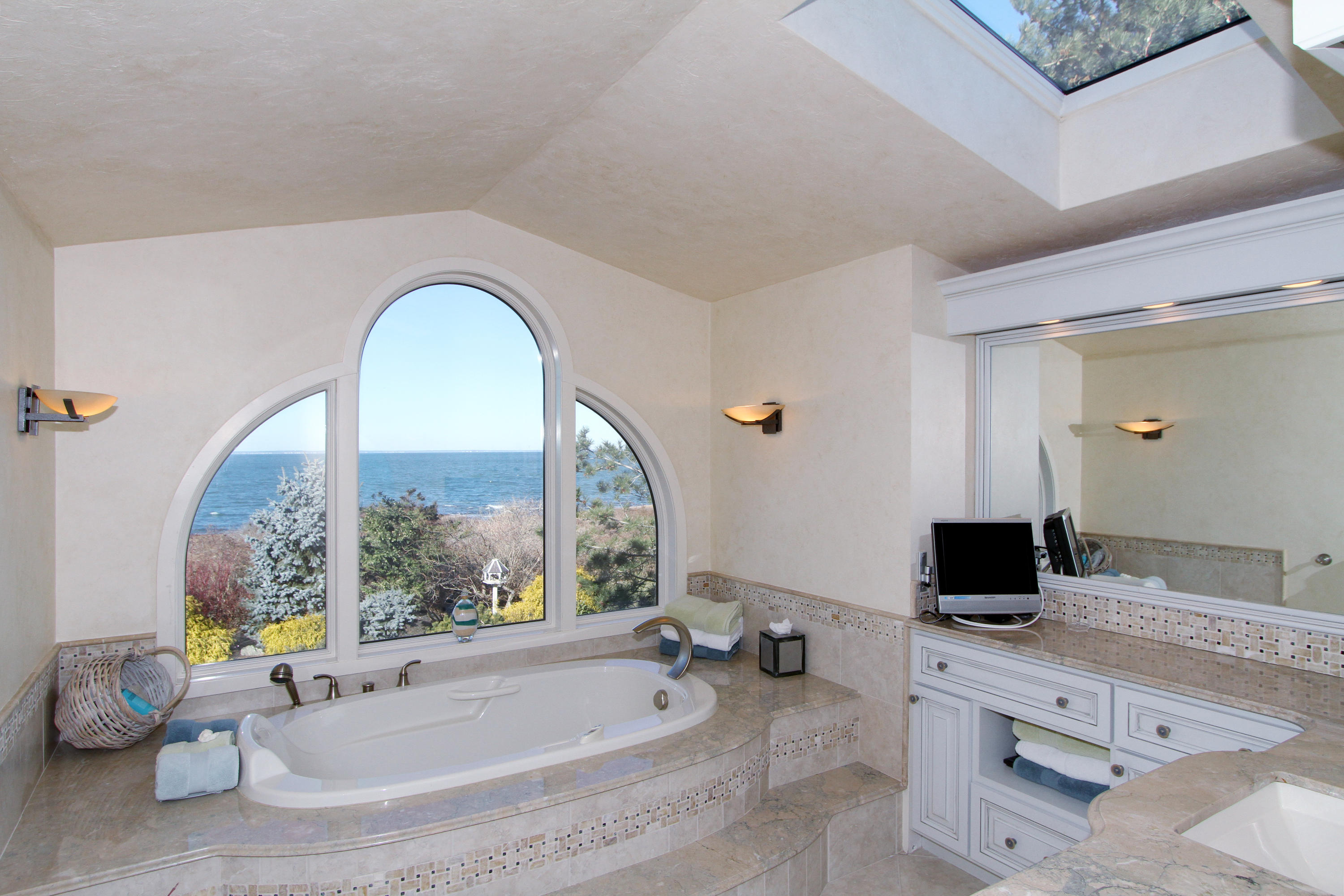 47 Gunning Point Road Falmouth, MA 02540 - Photo 17 of 33 a bathroom with a tub and a sink