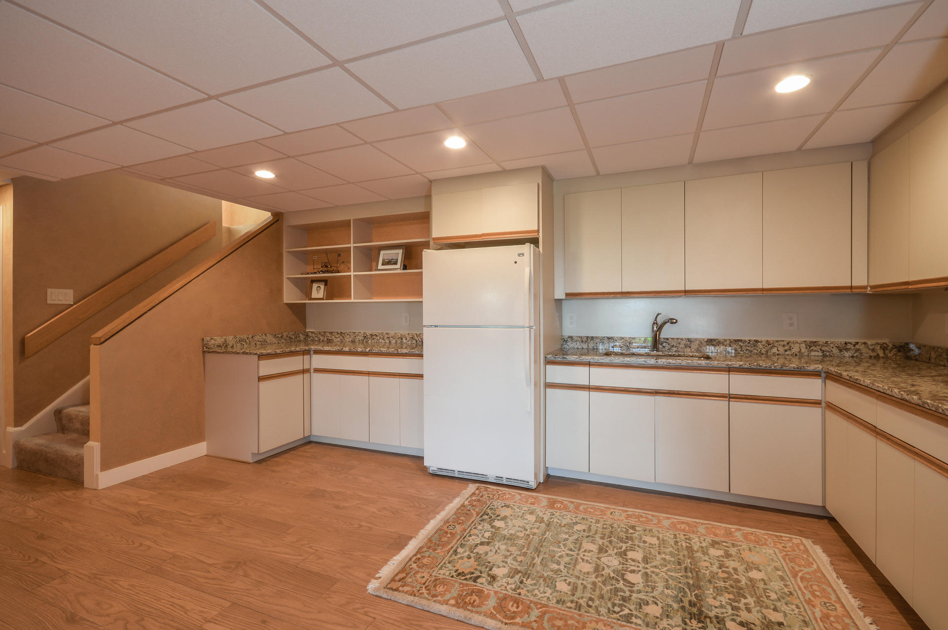 47 Gunning Point Road Falmouth, MA 02540 - Photo 28 of 33 a kitchen with granite countertop white cabinets and white appliances