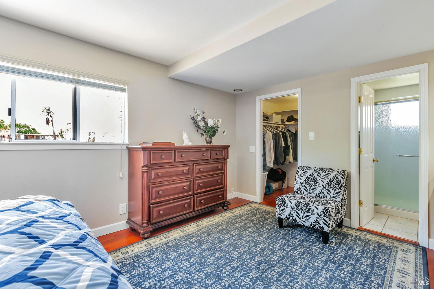 99 San Benito Way Novato, CA 94945 - Photo 11 of 30 a bedroom with a bed and a dresser