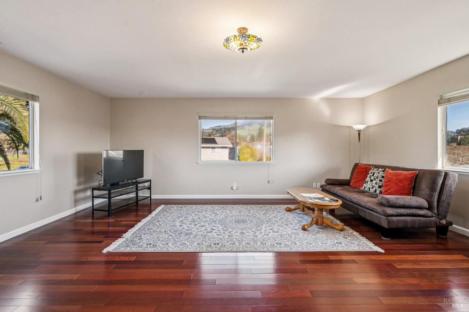 99 San Benito Way Novato, CA 94945 - Photo 15 of 30 a living room with furniture and a wooden floor