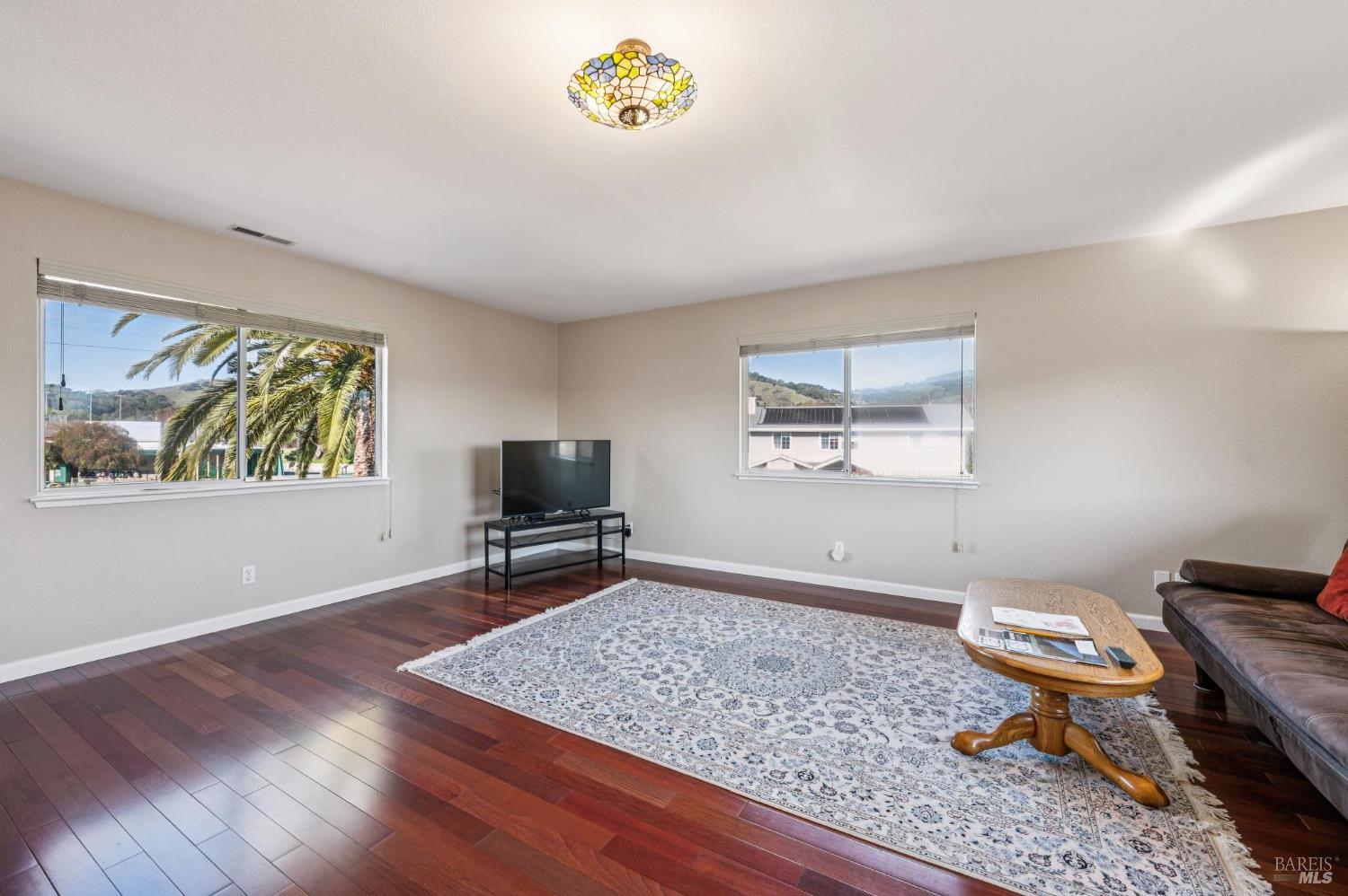 99 San Benito Way Novato, CA 94945 - Photo 16 of 30 a living room with a couch and a window