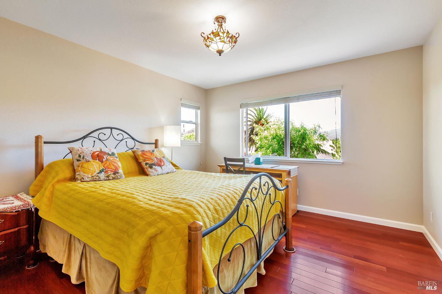 99 San Benito Way Novato, CA 94945 - Photo 17 of 30 a bedroom with a bed and a window