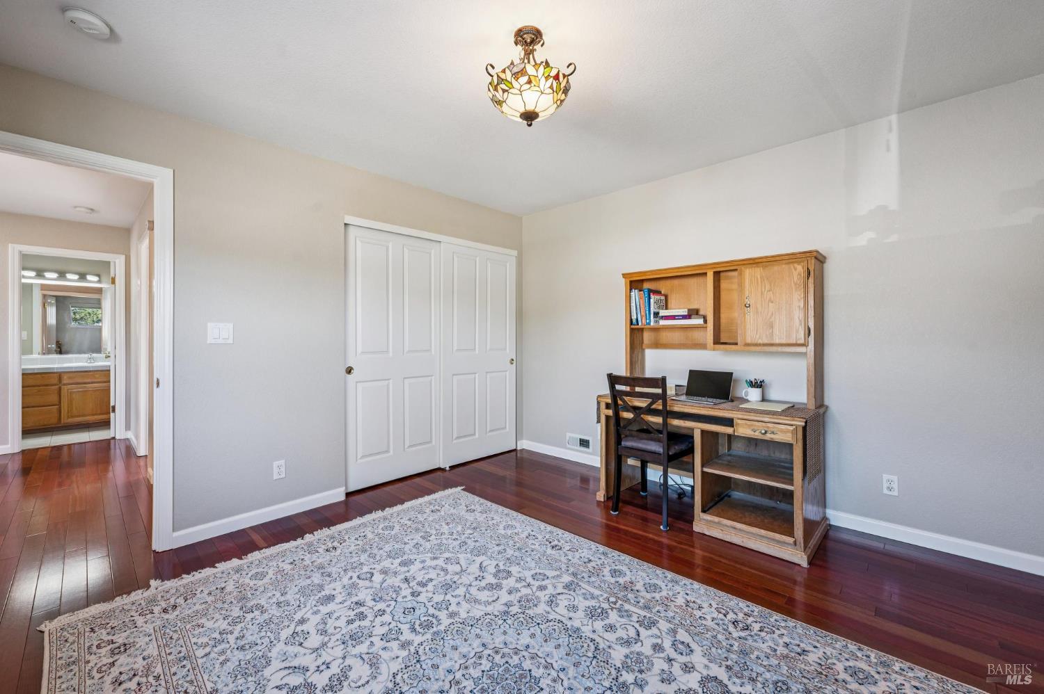 99 San Benito Way Novato, CA 94945 - Photo 19 of 30 a living room with furniture and a wooden floor