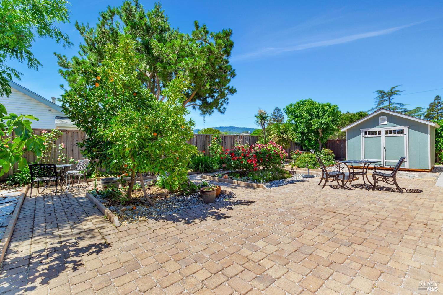 99 San Benito Way Novato, CA 94945 - Photo 23 of 30 a view of a house with backyard and sitting area