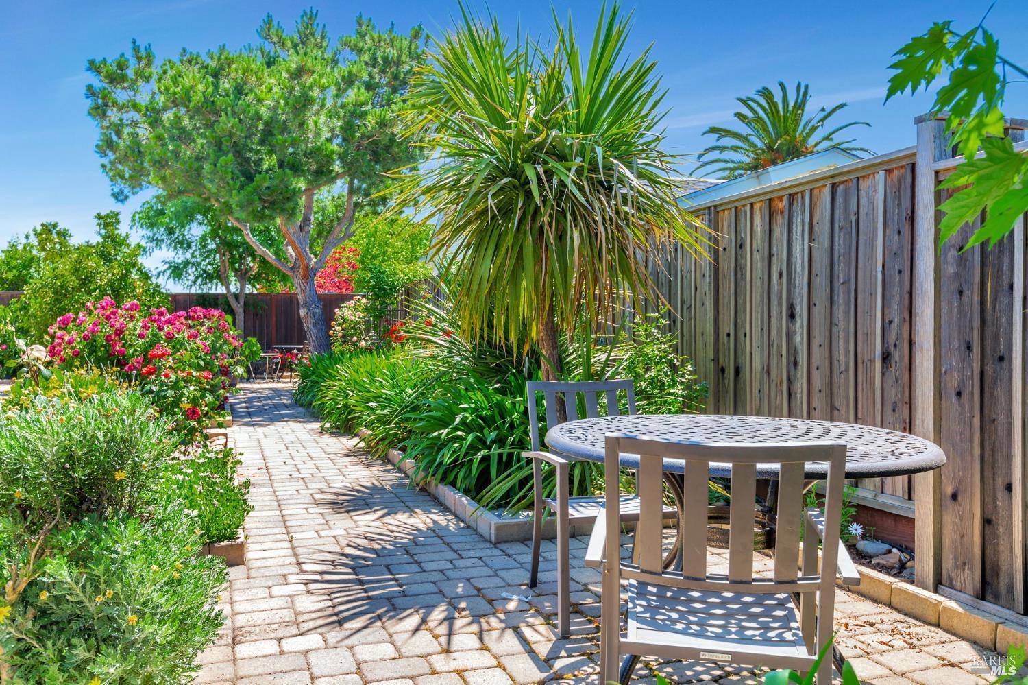 99 San Benito Way Novato, CA 94945 - Photo 25 of 30 a view of a dinning table and chairs in patio