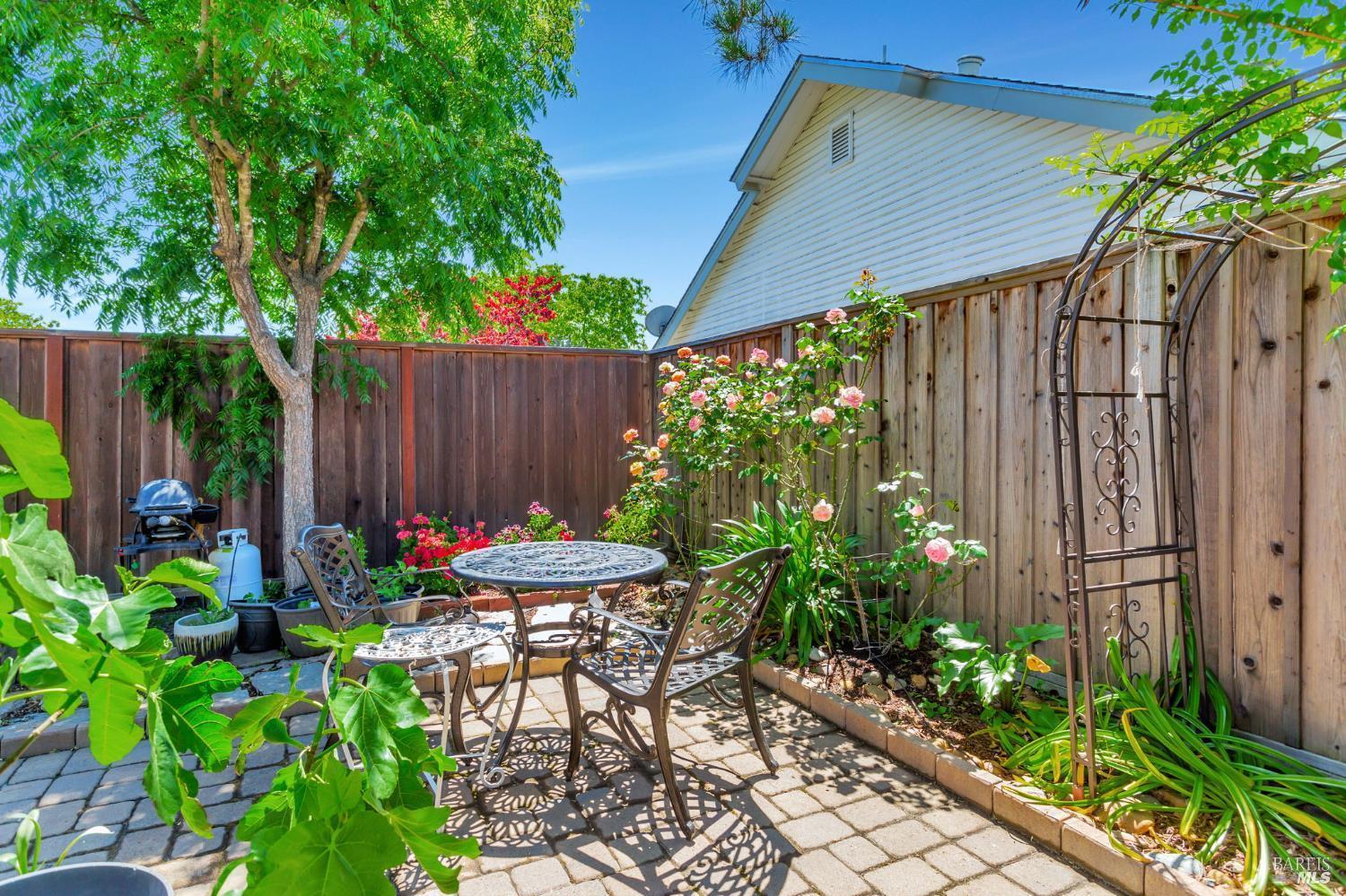 99 San Benito Way Novato, CA 94945 - Photo 27 of 30 a backyard of a house with a garden and plants