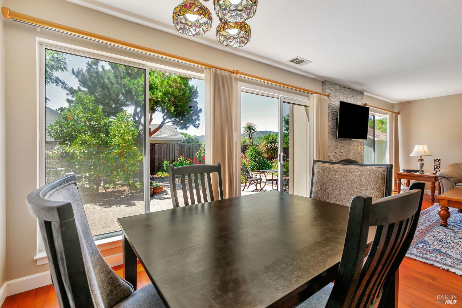 99 San Benito Way Novato, CA 94945 - Photo 8 of 30 a view of a dining room with furniture window and wooden floor