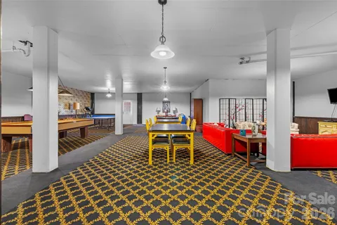 a room with lots of chairs and tables