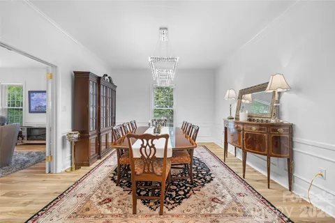 a spacious bedroom with a bed and a refrigerator