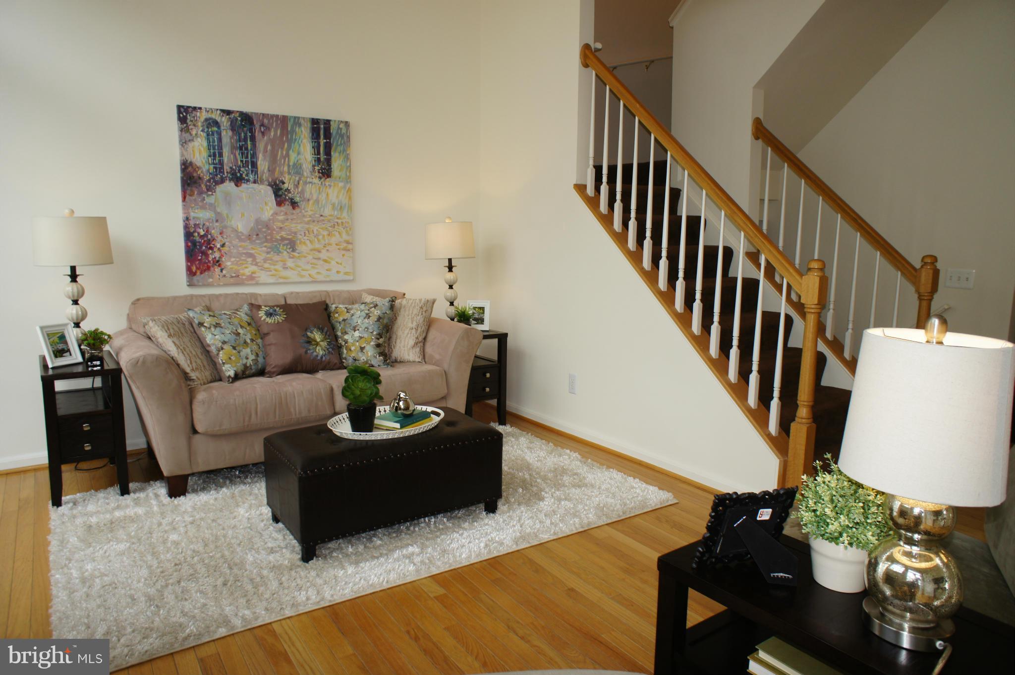 6021 Riddle Walk Alexandria, VA 22312 - Photo 12 of 30 a living room with furniture and a wooden floor