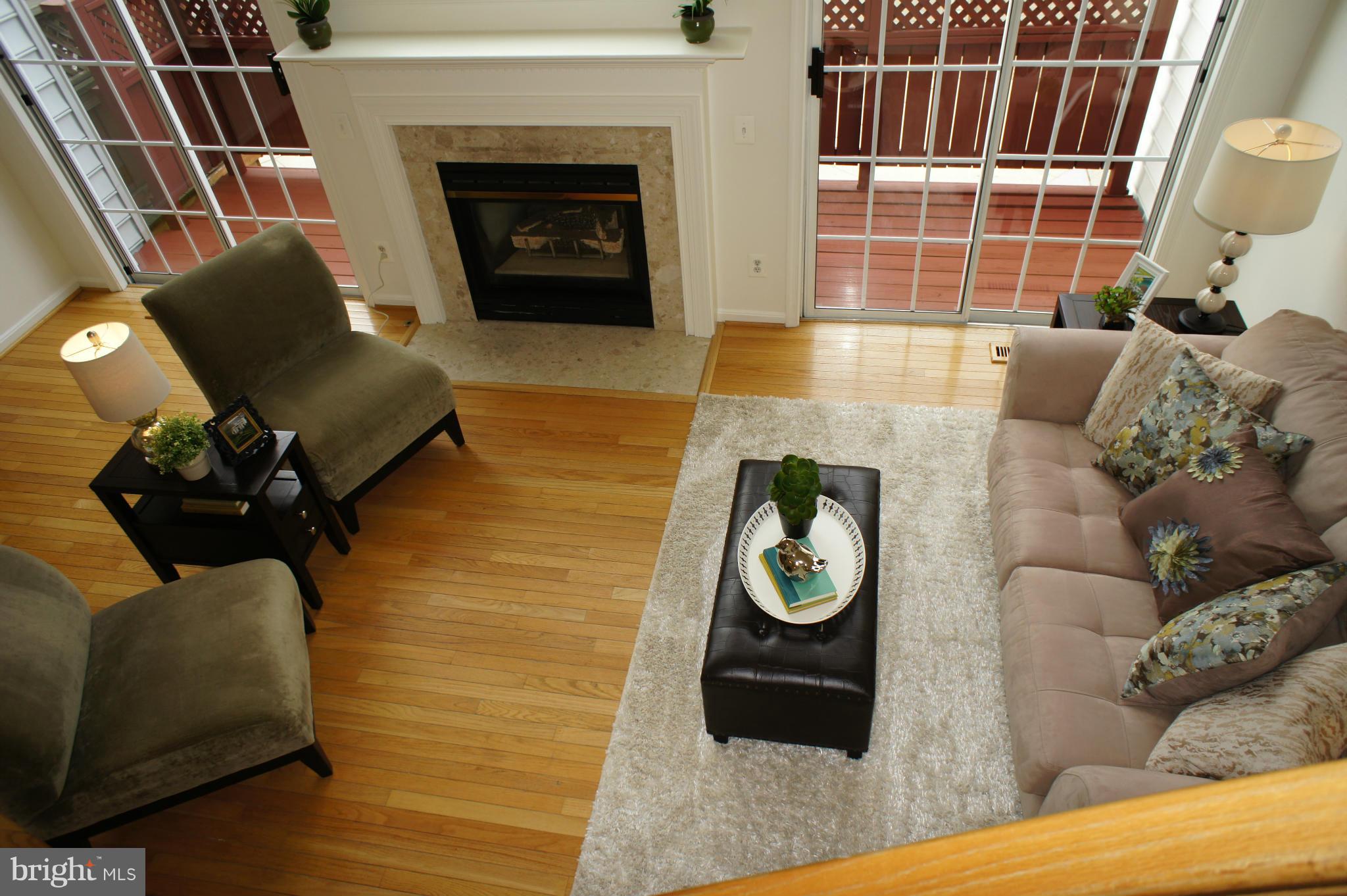 6021 Riddle Walk Alexandria, VA 22312 - Photo 13 of 30 a living room with furniture and a fireplace
