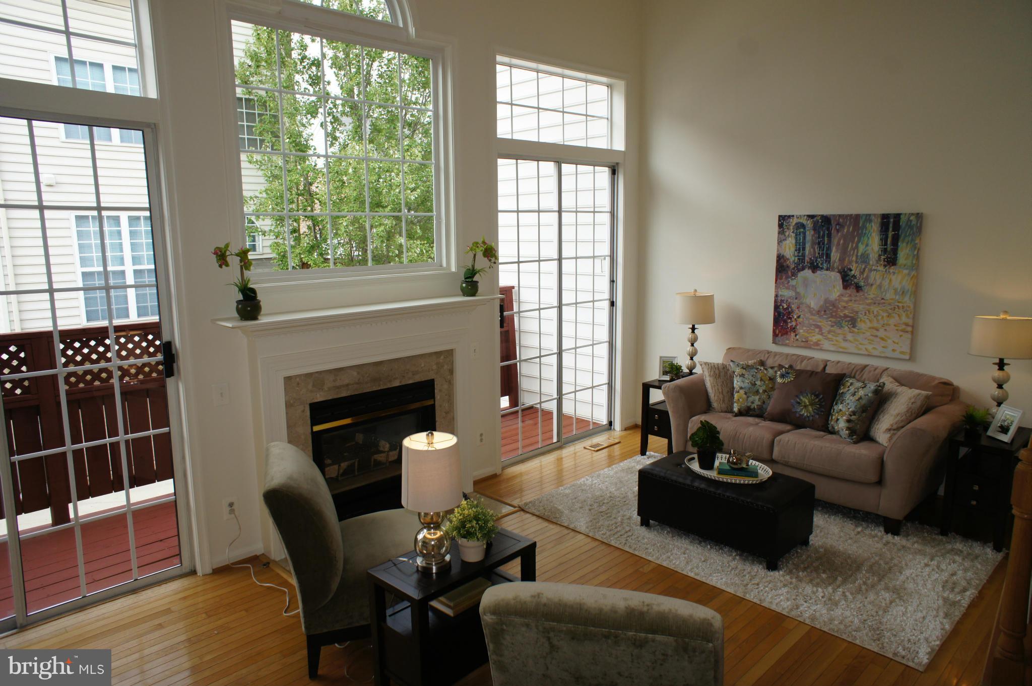 6021 Riddle Walk Alexandria, VA 22312 - Photo 14 of 30 a living room with furniture and a fireplace