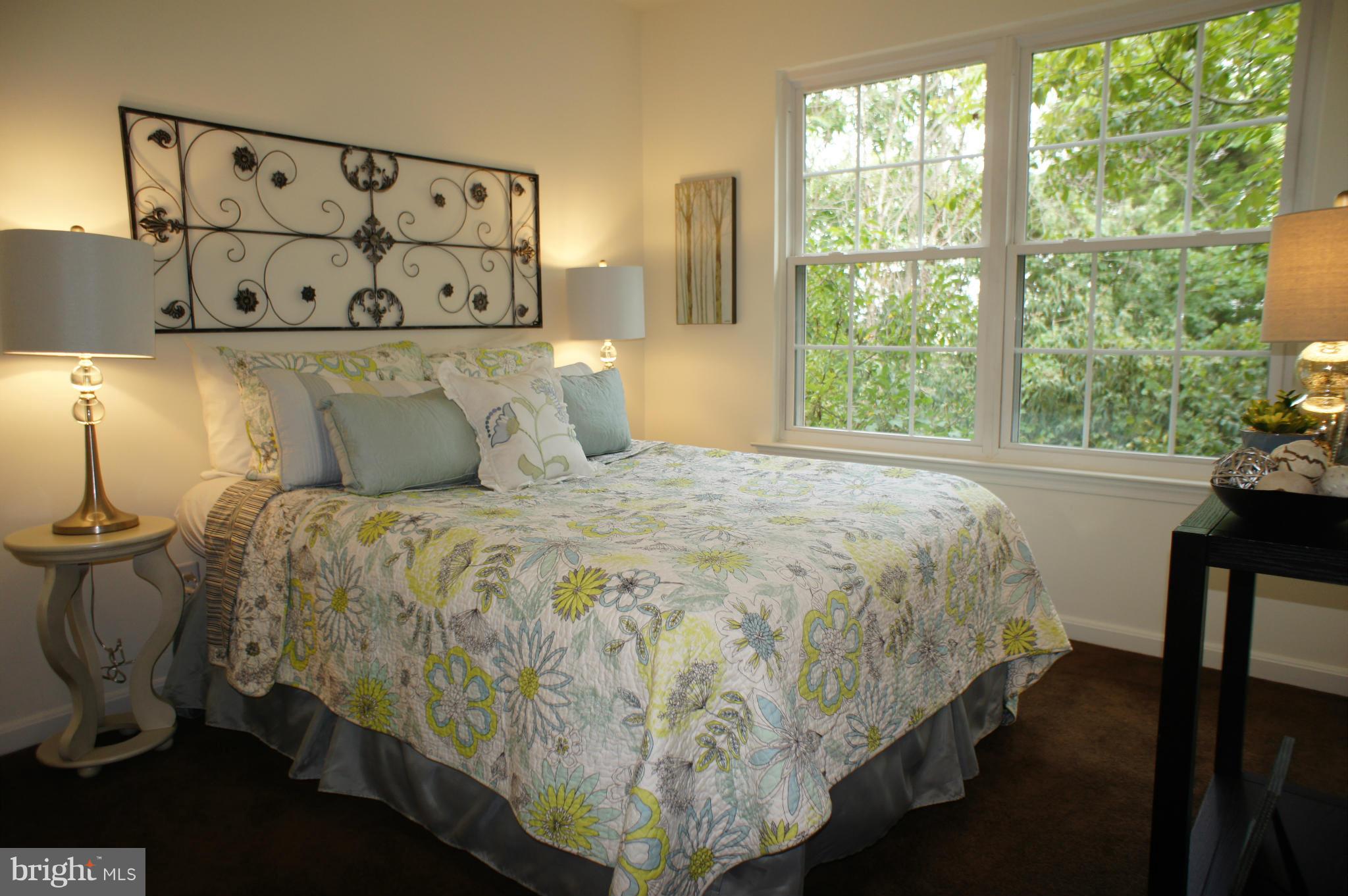 6021 Riddle Walk Alexandria, VA 22312 - Photo 19 of 30 a bed sitting in a bedroom next to a window