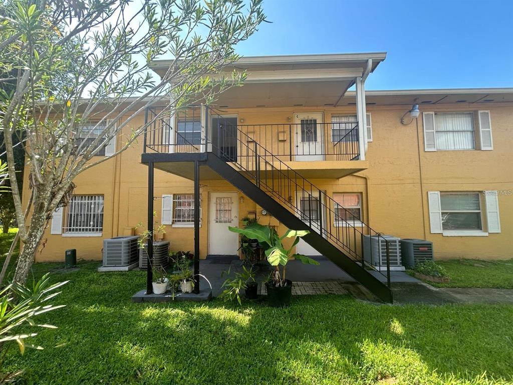 1627 West Oak Ridge Road, Unit D Orlando, FL 32809 - Photo 2 of 17 a view of house with a yard