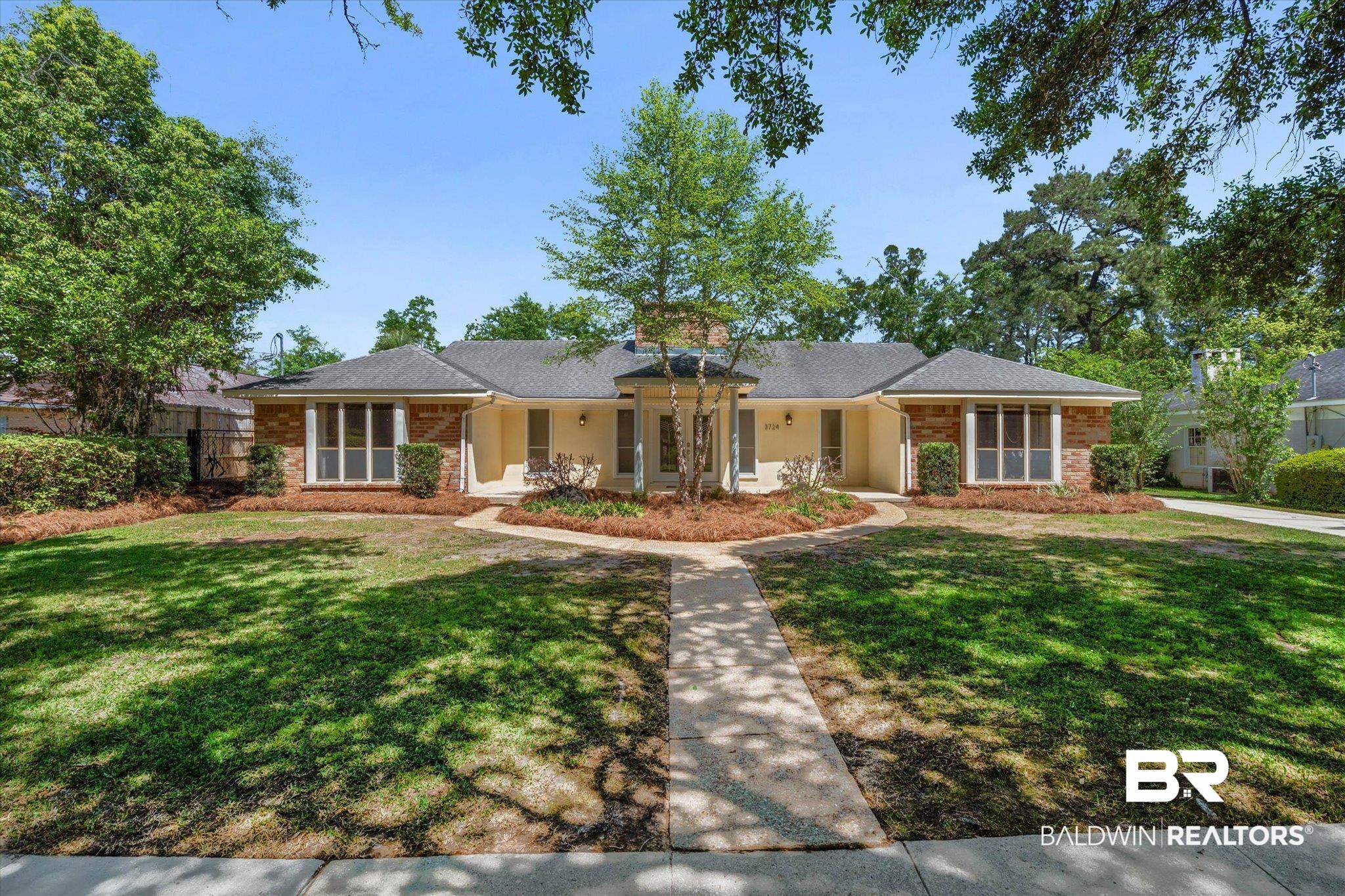 3724 Claridge Road South Mobile, AL 36608 - Photo 2 of 42 Ranch-style house with brick siding, a front yard, a porch, and a shingled roof