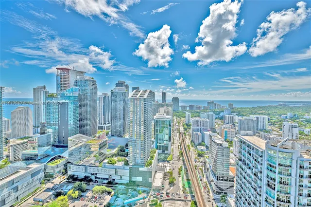 a view of a hall with lots of gym equipment