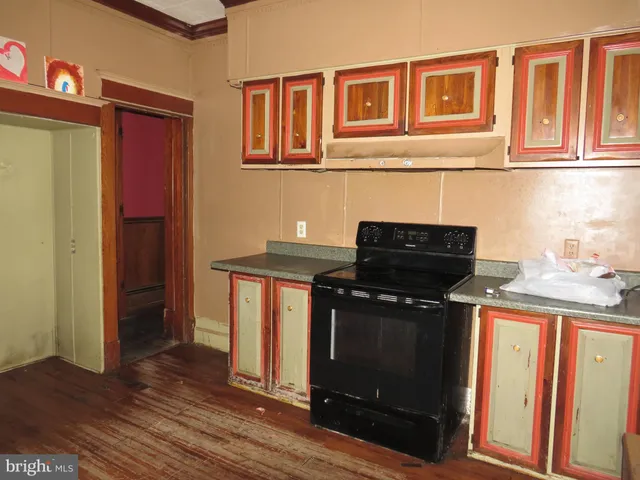 a kitchen with stainless steel appliances granite countertop a stove and a refrigerator