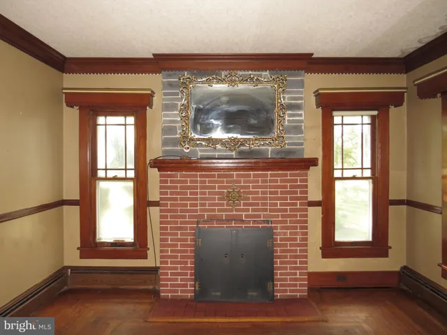 a front view of a house with a large window