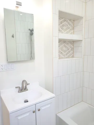 a bathroom with a sink and a bathtub