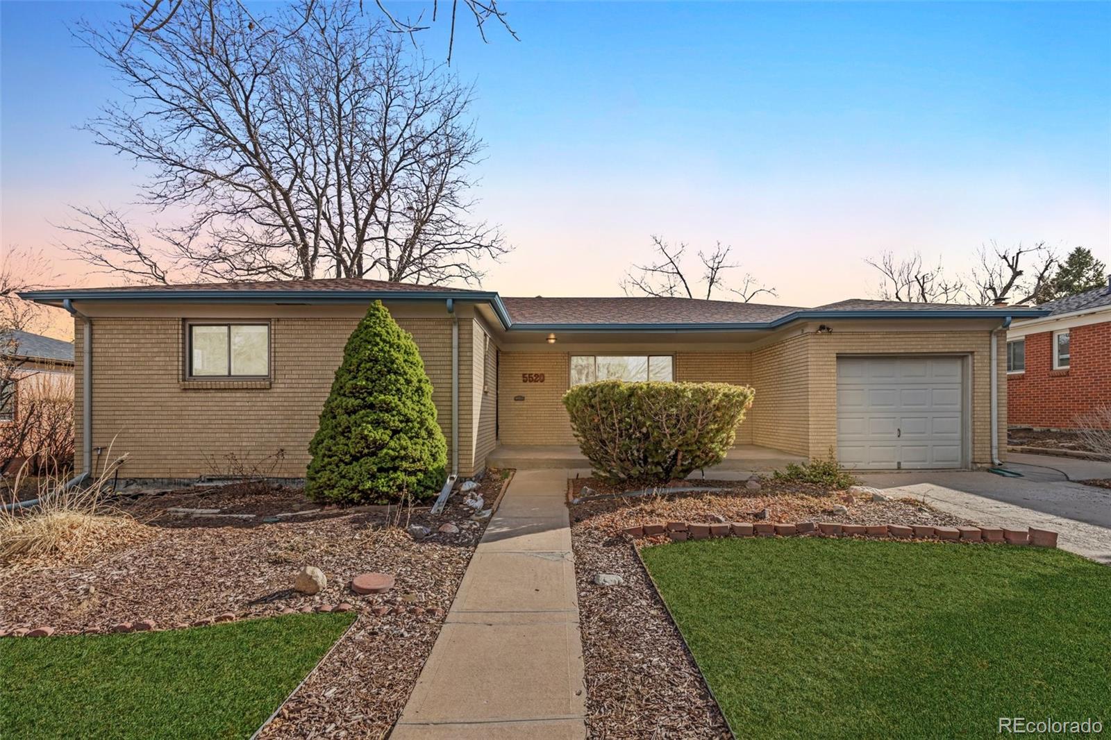 a view of a house with a yard