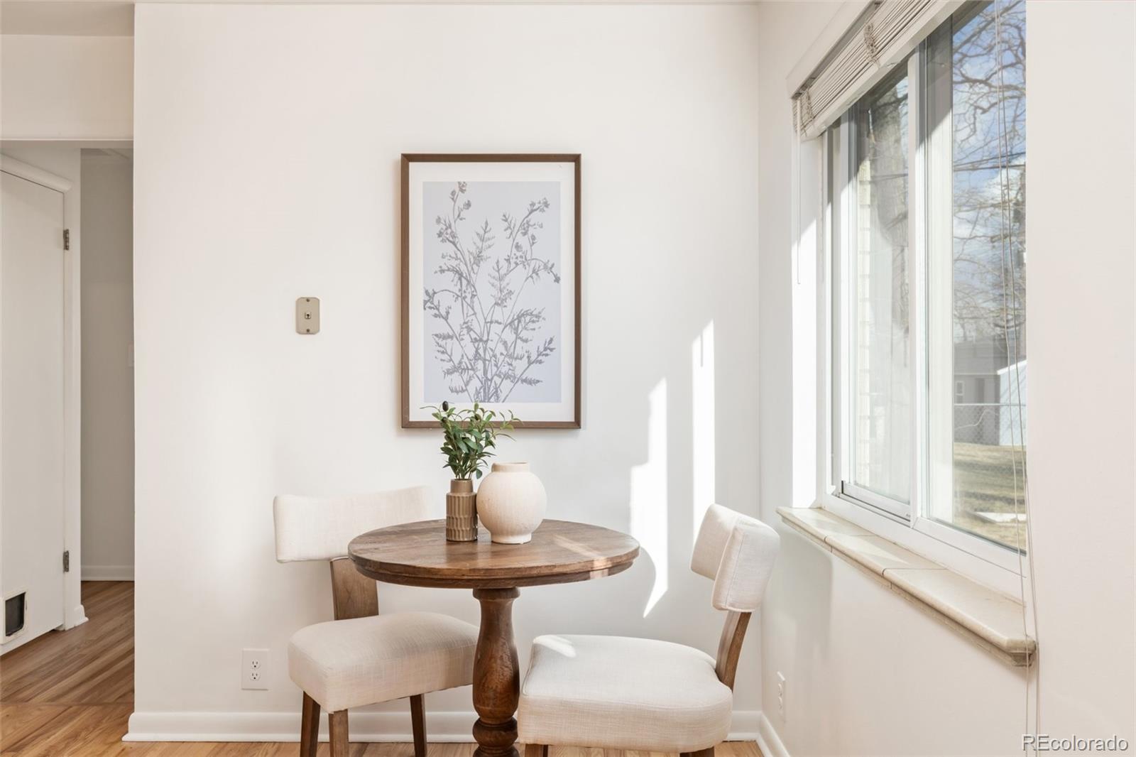 5520 East Bails Drive Denver, CO 80222 - Photo 11 of 38 a view of a room with furniture and a window