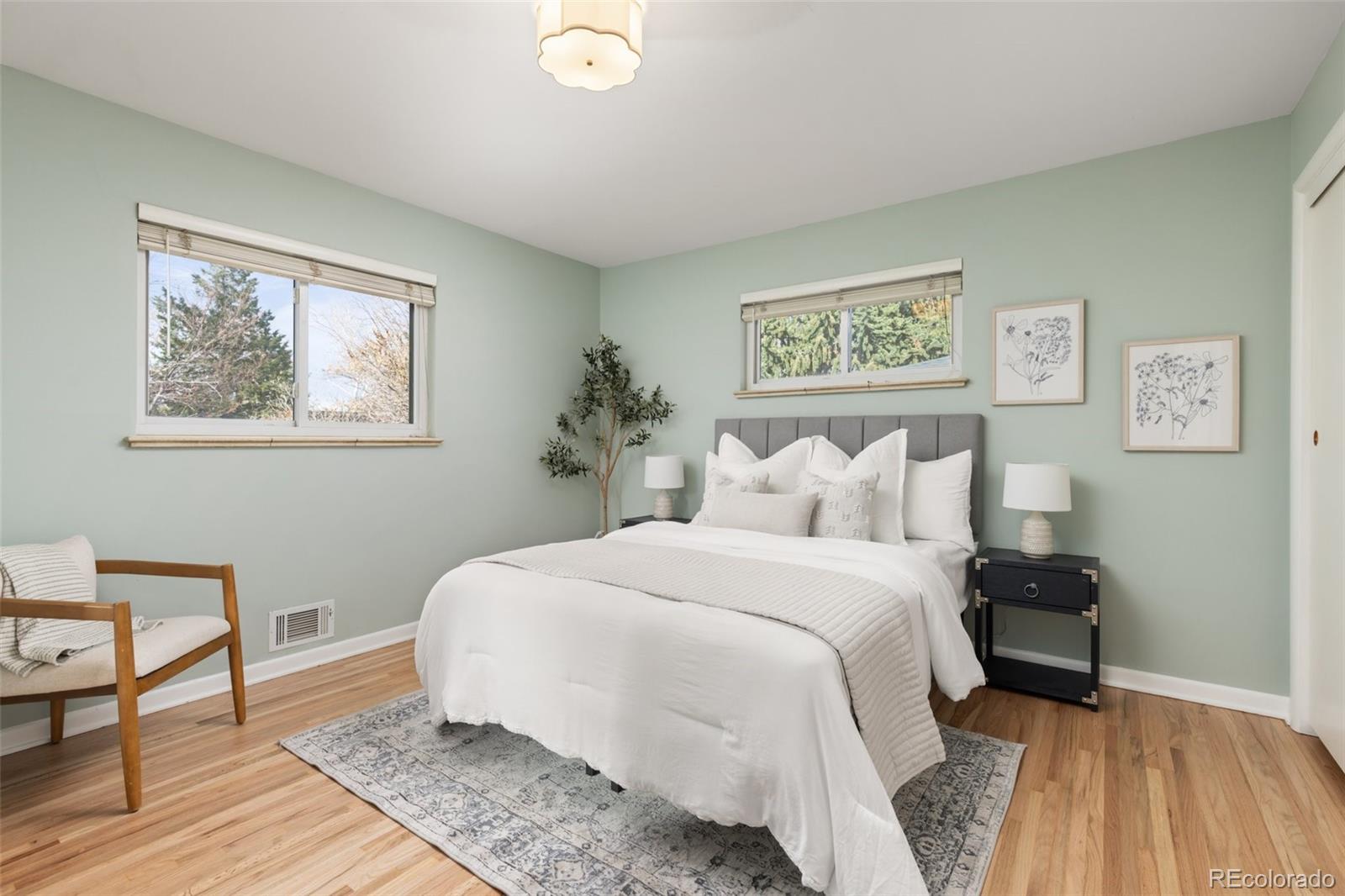 5520 East Bails Drive Denver, CO 80222 - Photo 12 of 38 a bedroom with bed and night stand