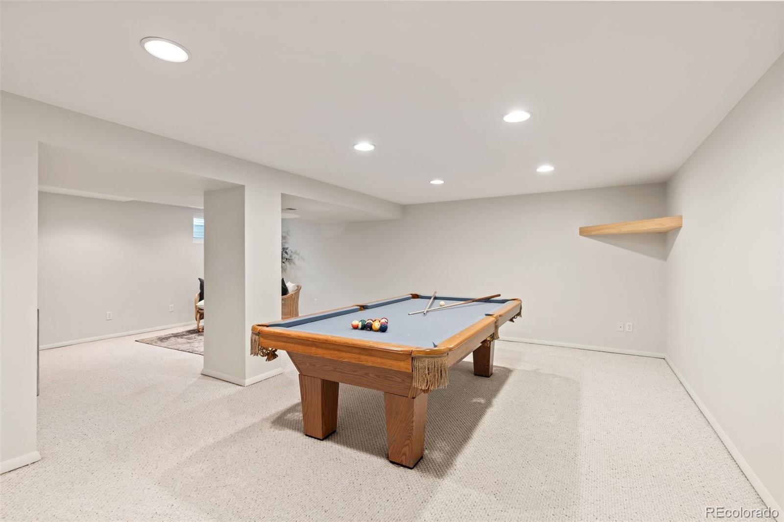 5520 East Bails Drive Denver, CO 80222 - Photo 18 of 38 a room with table and chairs