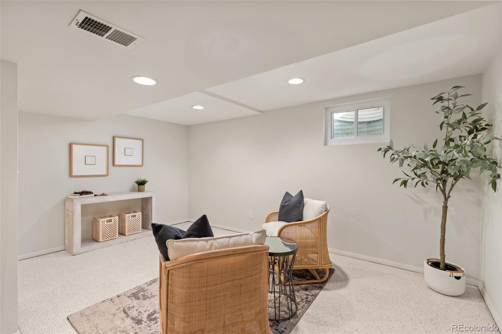 5520 East Bails Drive Denver, CO 80222 - Photo 19 of 38 a living room with furniture and a potted plant