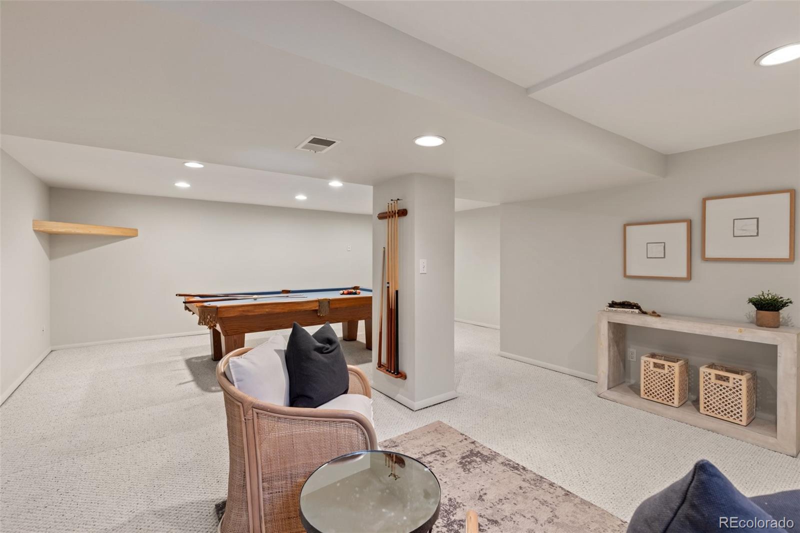 5520 East Bails Drive Denver, CO 80222 - Photo 20 of 38 a hallway with table and a couch