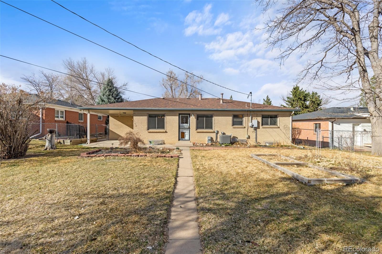5520 East Bails Drive Denver, CO 80222 - Photo 23 of 38 a front view of a house with swimming pool