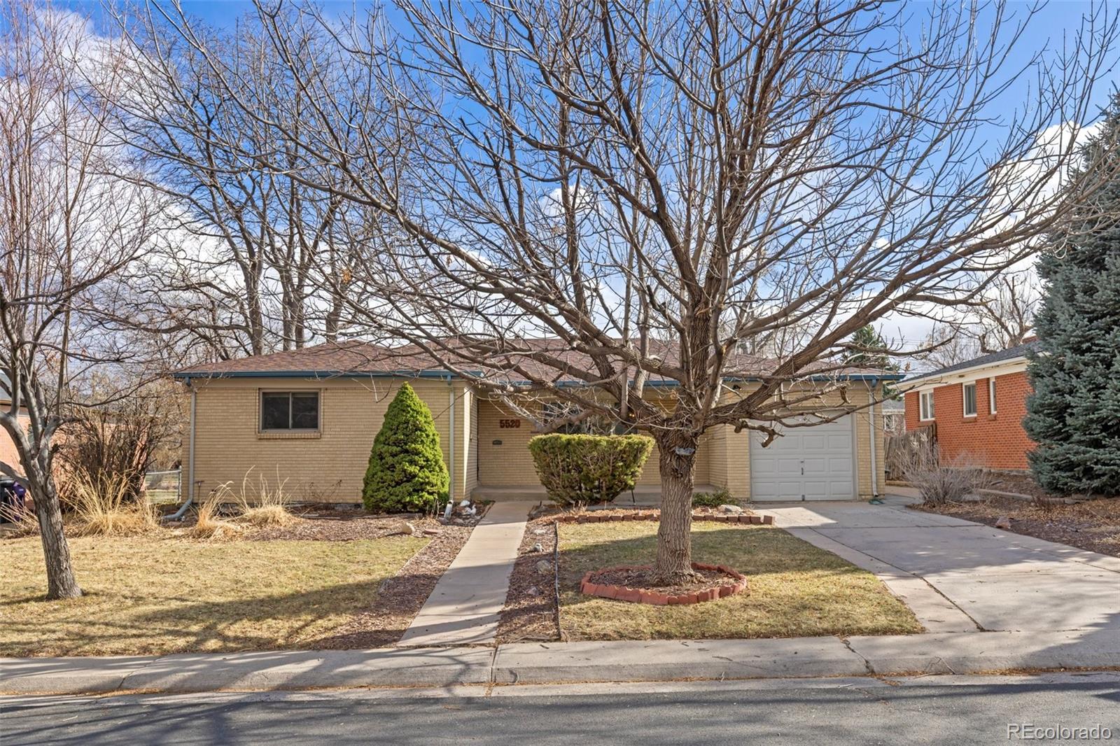 5520 East Bails Drive Denver, CO 80222 - Photo 28 of 38 a view of a yard with a tree s