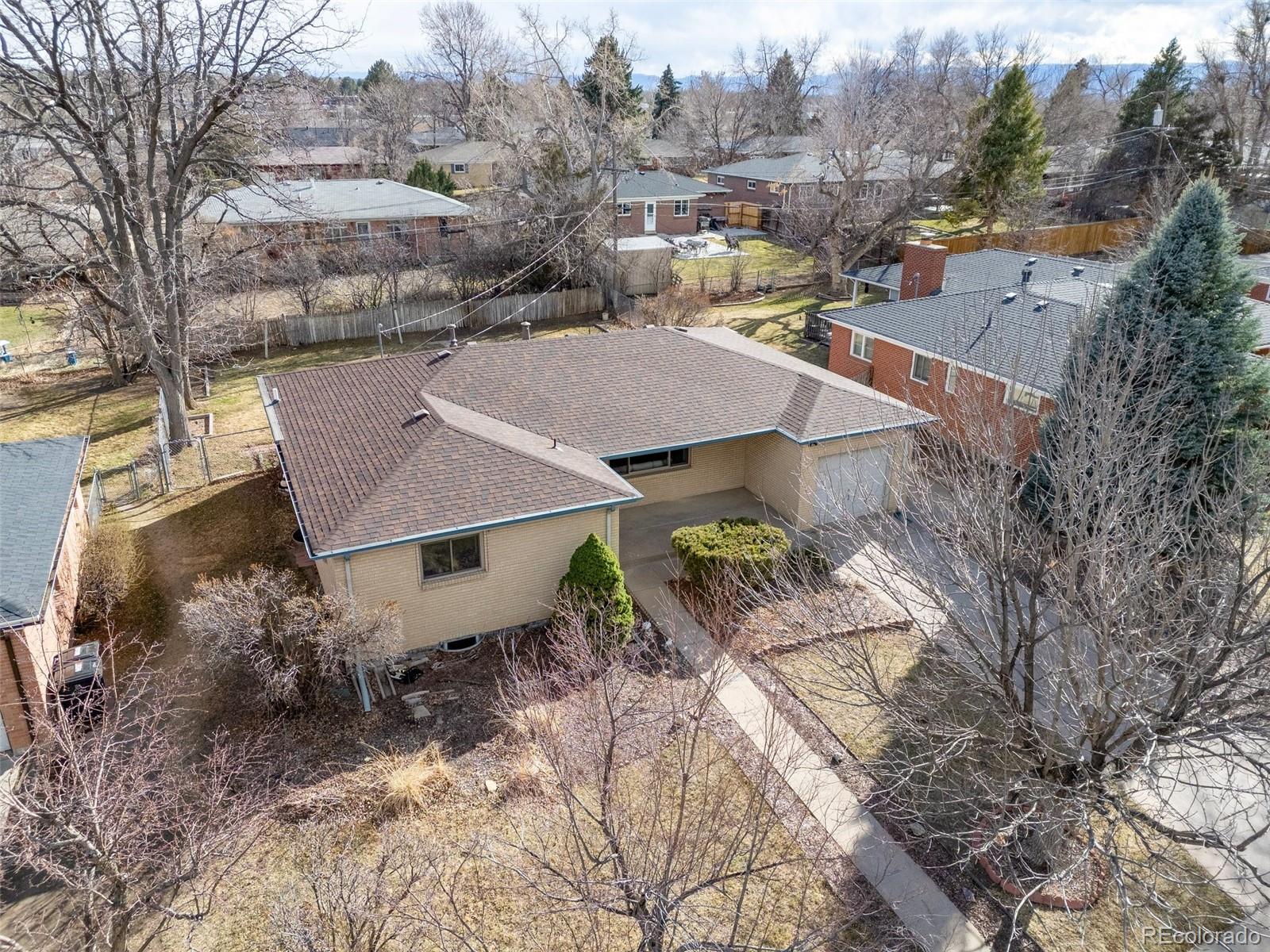 5520 East Bails Drive Denver, CO 80222 - Photo 31 of 38 an aerial view of a house with a yard and mountain