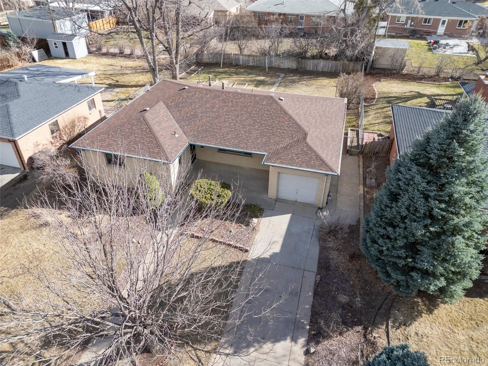 5520 East Bails Drive Denver, CO 80222 - Photo 32 of 38 a aerial view of a house with a yard and potted plants