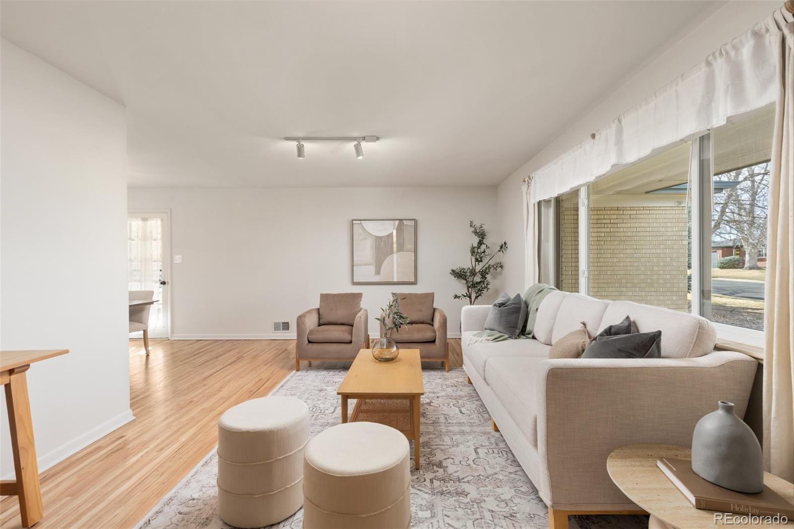 5520 East Bails Drive Denver, CO 80222 - Photo 4 of 38 a living room with furniture and a potted plant