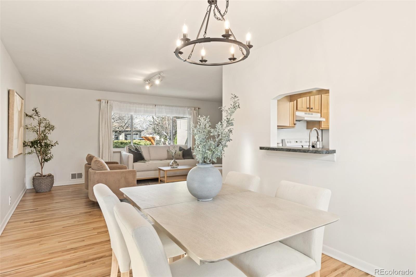 5520 East Bails Drive Denver, CO 80222 - Photo 8 of 38 a dining room with furniture and window