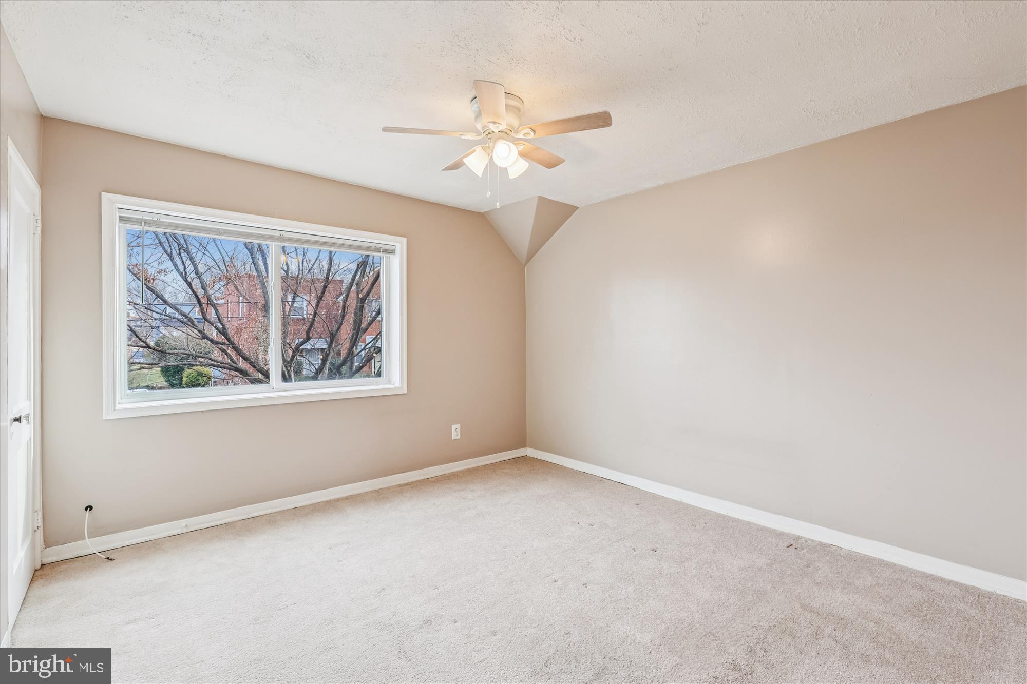 4007 1st Street Southwest Washington, DC 20032 - Photo 13 of 48 an empty room with a window and a fan