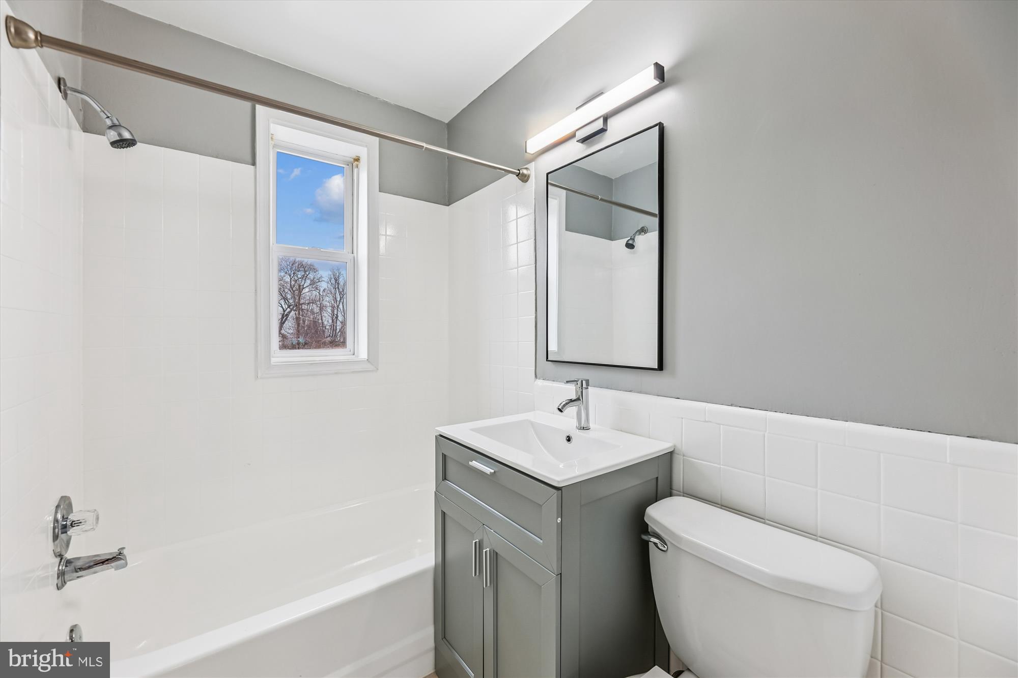 4007 1st Street Southwest Washington, DC 20032 - Photo 14 of 48 a bathroom with a sink a toilet and shower