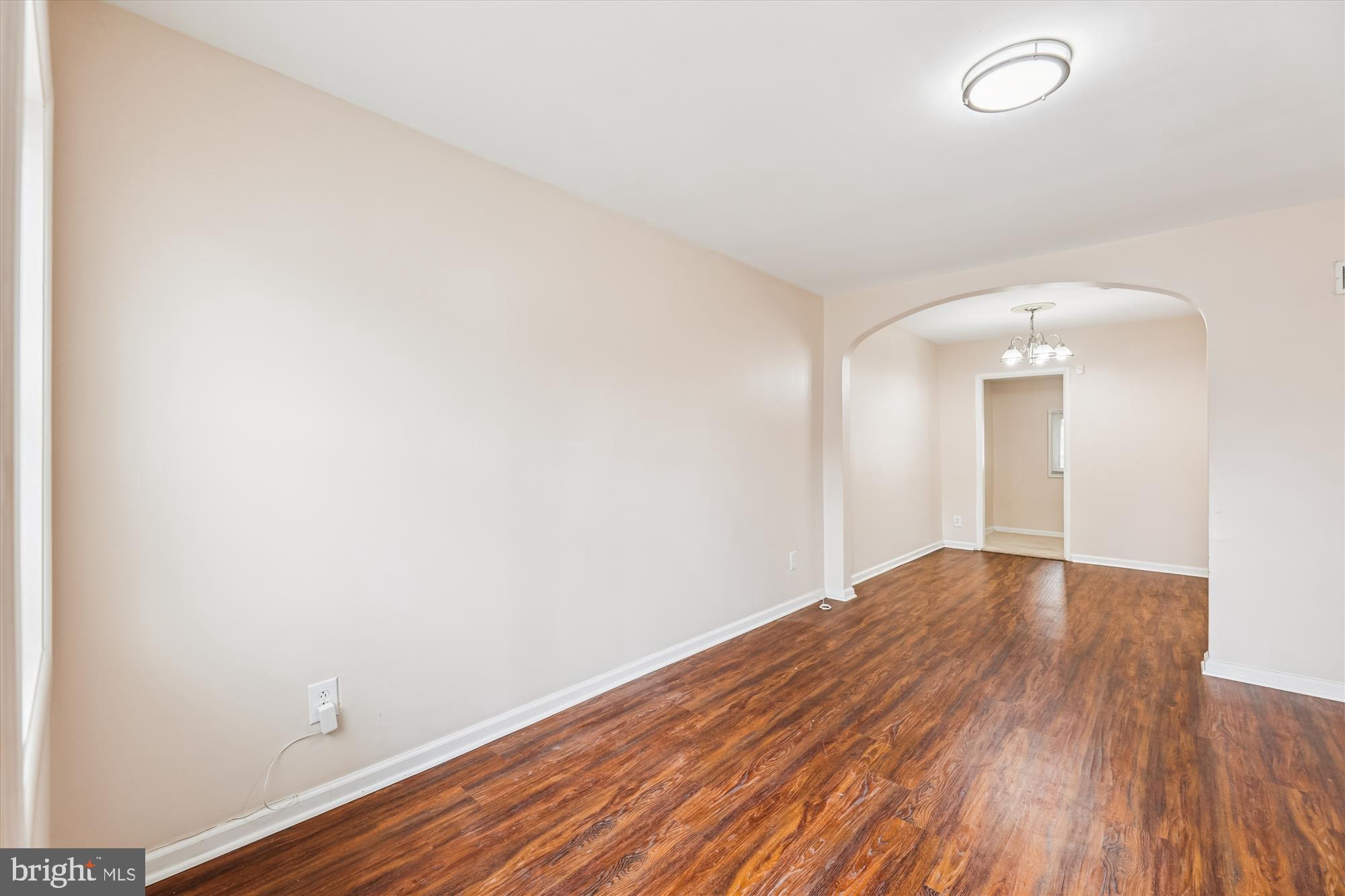 4007 1st Street Southwest Washington, DC 20032 - Photo 5 of 48 an empty room with wooden floor and windows