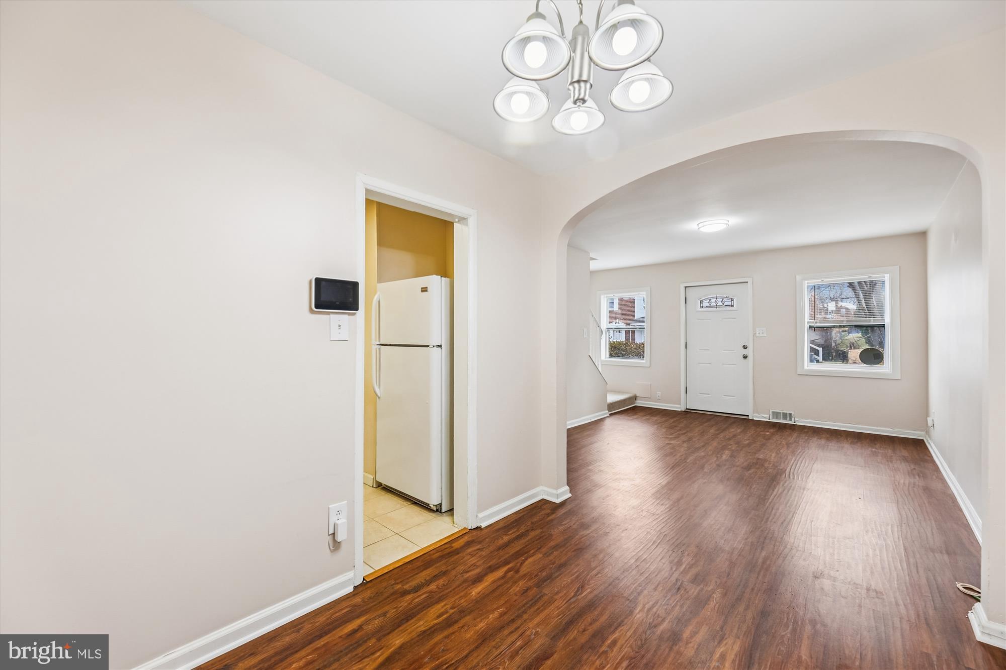 4007 1st Street Southwest Washington, DC 20032 - Photo 7 of 49 an empty room with wooden floor and door