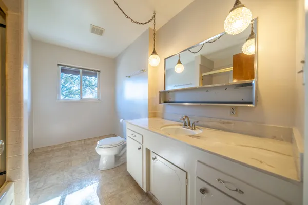 an aerial view of residential house with outdoor space and parking