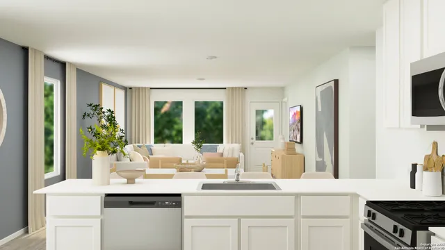 a kitchen with sink and large window