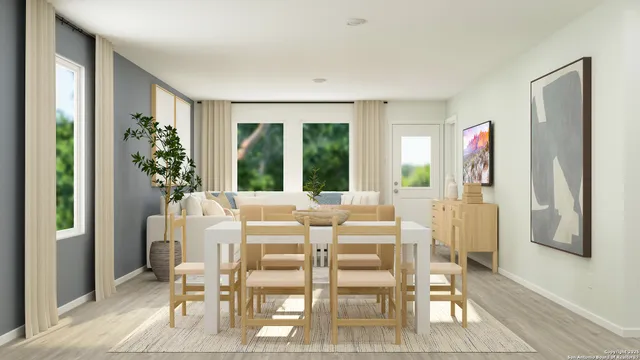 a view of a dining room with furniture window and outside view