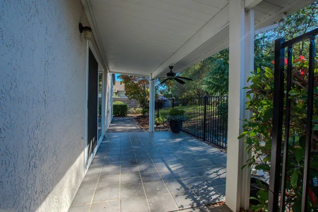 a view of a entryway door and potted plants