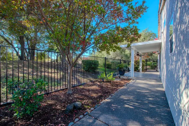 a view of a garden with patio