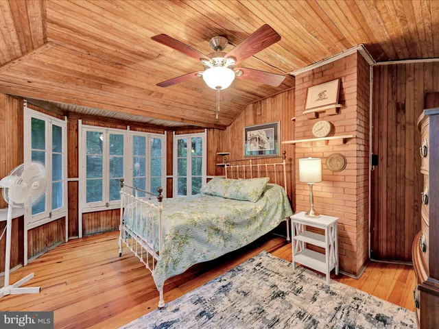 a bedroom with furniture and window