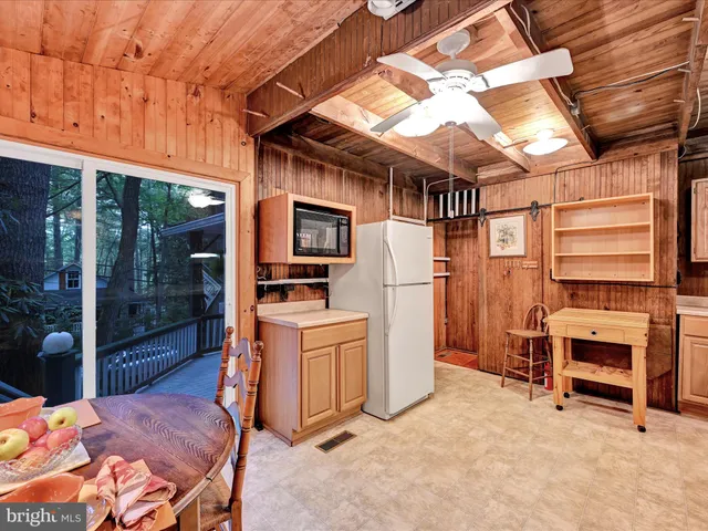 a kitchen with lots of counter top space and furniture